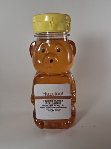 Honey bear container with a label on a white background