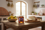 Turkish Lavender honey jar on a rustic farmhouse table in a Mediterranean kitchen with a bowl of lemons, sliced artisan bread, dried herbs, and warm morning light through an arched window | HeyHoney.biz